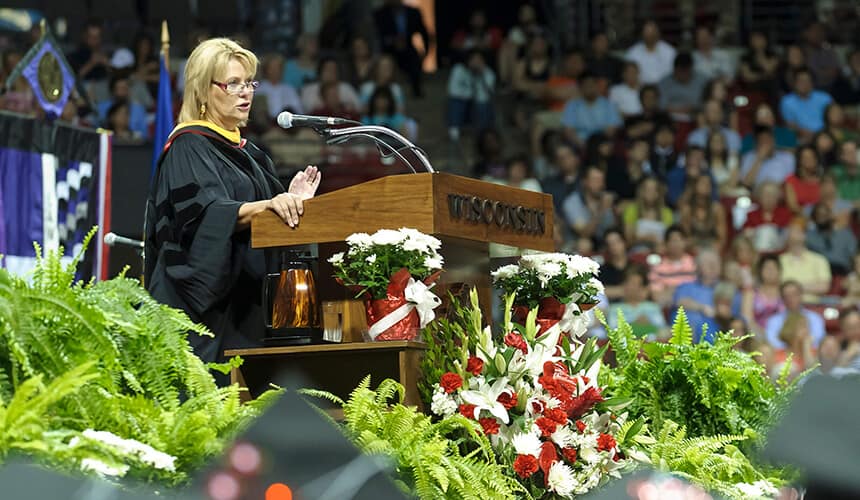 Bartz addressing the graduating class during the 2012 spring commencement ceremony at the Kohl Center.