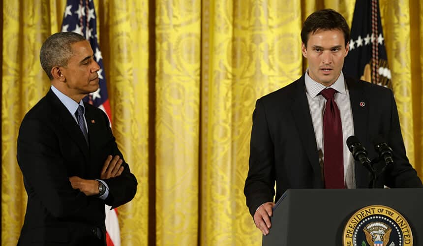 President Barack Obama listens as he is introduced by Jake Wood, co-Founder of Team Rubicon