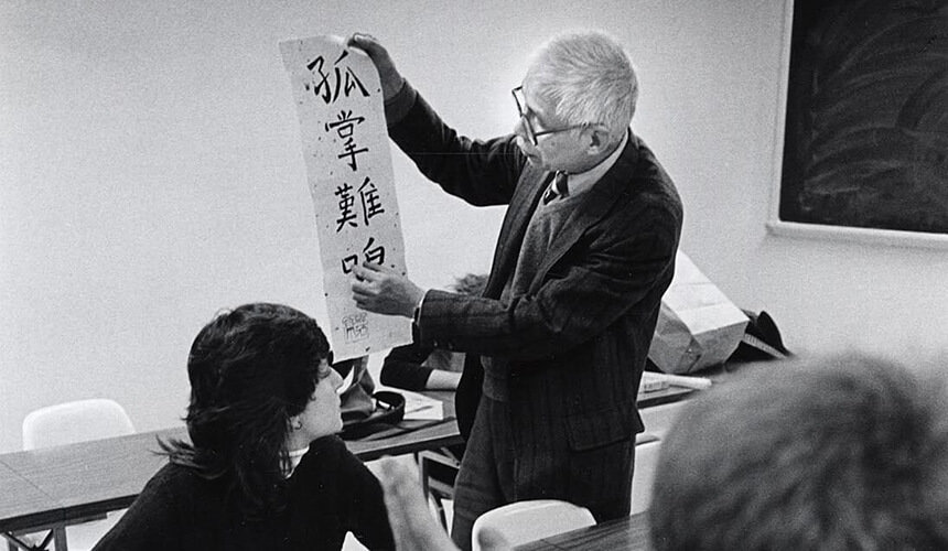 UW professor Tse-Tsung Chow showing his students an example of Chinese calligraphy.