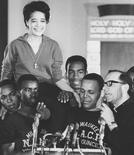 Vel Phillips being carried on the shoulders of Milwaukee NAACP Youth Council members.