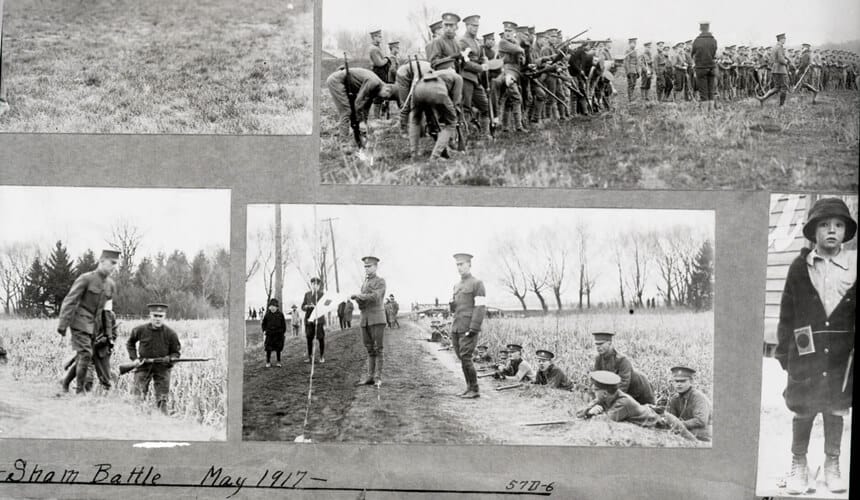 A scrapbook page shows images of cadets in a mock battle on campus during World War I.
