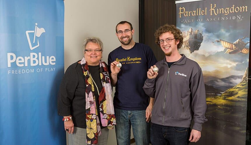 Beck and Woolworth, with Paula Bonner, recieving their 2013 Wisconsin Alumni Association Forward under 40 Awards.