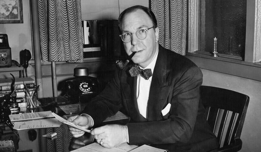 Charles Wedemeyer, shown in 1953 smoking a tobacco pipe at his desk. (Image courtesy of UW Archives, #S01147.) Charles Wedemeyer, shown in 1953 smoking a tobacco pipe at his desk.
