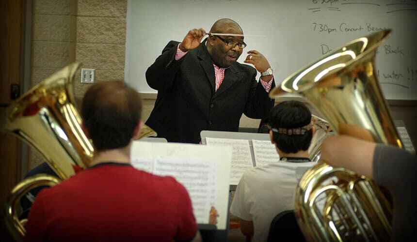 Demondrae Thurman directs student musicians of euphonium and tuba at the University of Alabama. (Image courtesy of the University of Alabama.) Demondrae Thurman directing student musicians.