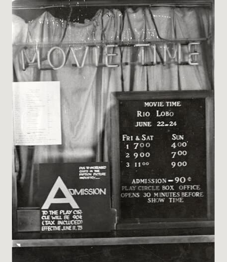 Ticket prices sign at movie theater.