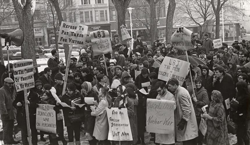 Students carried signs protesting the U.S. government’s announcement of a draft lottery in 1969. (Image courtesy of UW Digital Collections.) Students carried signs protesting the U.S. government’s announcement of a draft lottery in 1969.