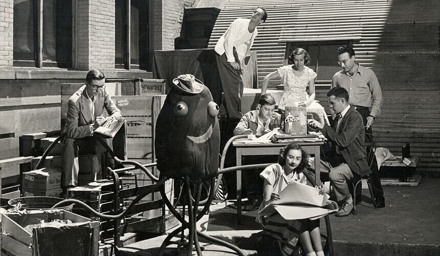 Members of Octopus staff work outdoors surrounded by furniture and an octopus sculpture in the 50's. (Image courtesy of the UW Archives, #S06701.) Members of Octopus staff work outdoors surrounded by furniture and an octopus sculpture in the 50's.