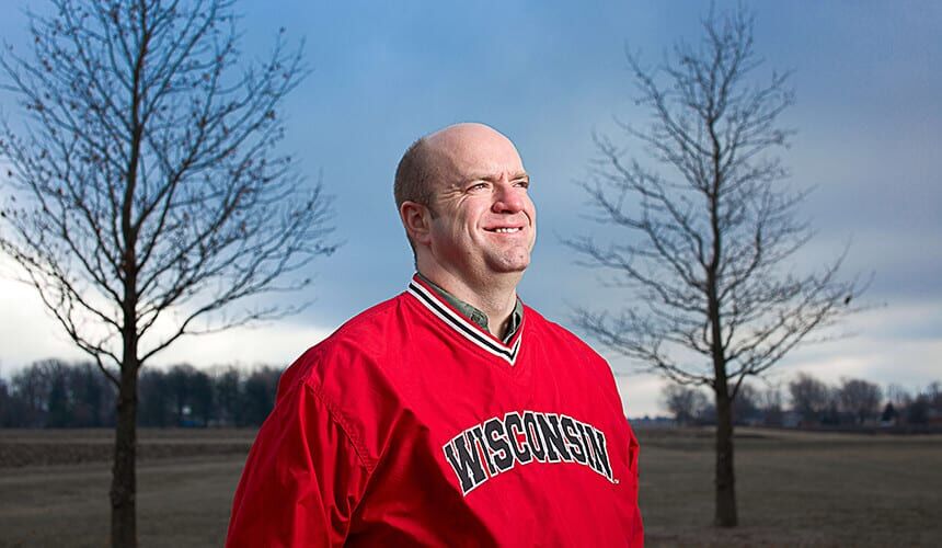 Koch has had a hand in increasing the growing potential of corn in areas where rural farmers struggle to produce adequate harvests. (Photo by Mike Randolph.) Tom Koch proudly wearing a Wisconsin pullover.