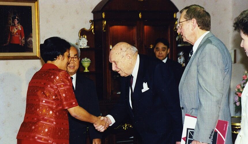 William Young, center, greeted members of a Thailand delegation during a cultural exchange program at Edgewood College in 2000.