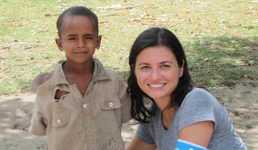 Casey Rotter with a kid she worked with through UNICEF.