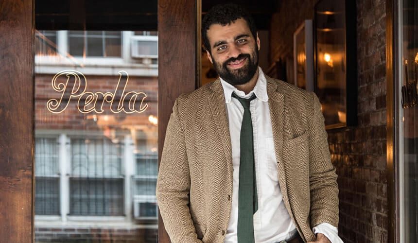Gabriel Stulman standing outside his restaurant.