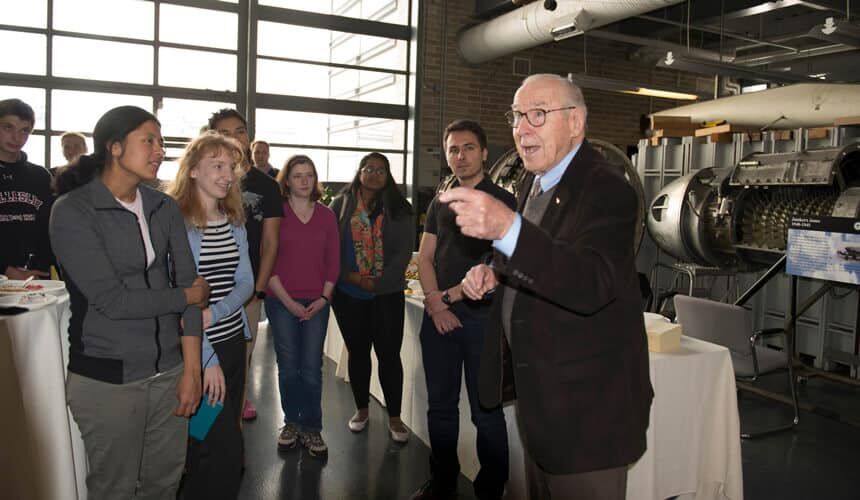 Lovell speaking with students at MIT.