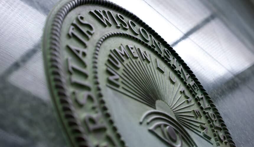 An emblem of the University of Wisconsin "Numen Lumen" seal is pictured on a marble wall in Engineering Hall. (Image courtesy of University Communications, #12716.) An emblem of the University of Wisconsin "Numen Lumen" seal is pictured on a marble wall in Engineering Hall.