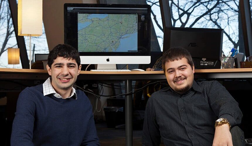 Scott Resnick and Jon Hardin sitting near a computer.