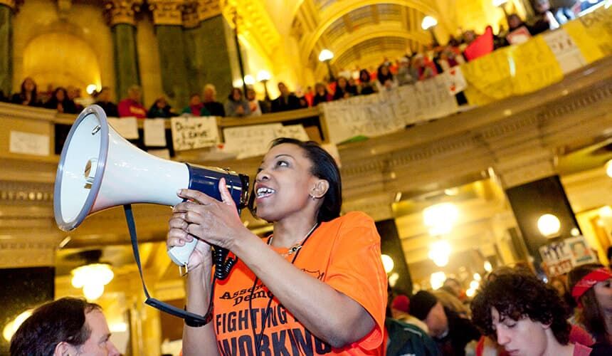 Tamara Grigsby with a bullhorn in the capitol rotunda. (Photo courtesy of Tamara Grigsby.) Tamara Grigsby with a bullhorn.