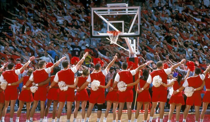 Cheerleaders singing varsity with Badger fans. (Image courtesy of University Communications.) Cheerleaders singing varsity with Badger fans.