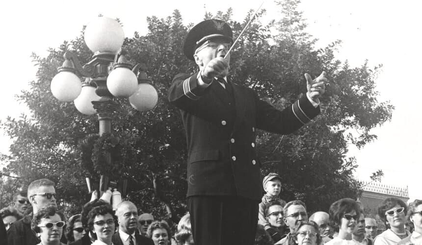 Long-time Wisconsin Band Director Ray Dvorak at a pre-bowl game celebration, c. 1963. (Image courtesy of the UW Digital Collections.) Long-time Wisconsin Band Director Ray Dvorak at a pre-bowl game celebration, c. 1963.