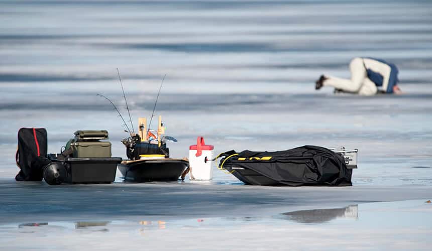 A man preparing for ice fishing