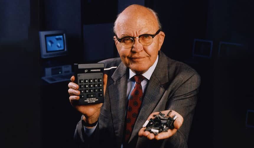 Jack St. Clair Kilby holding a palm-sized calculator