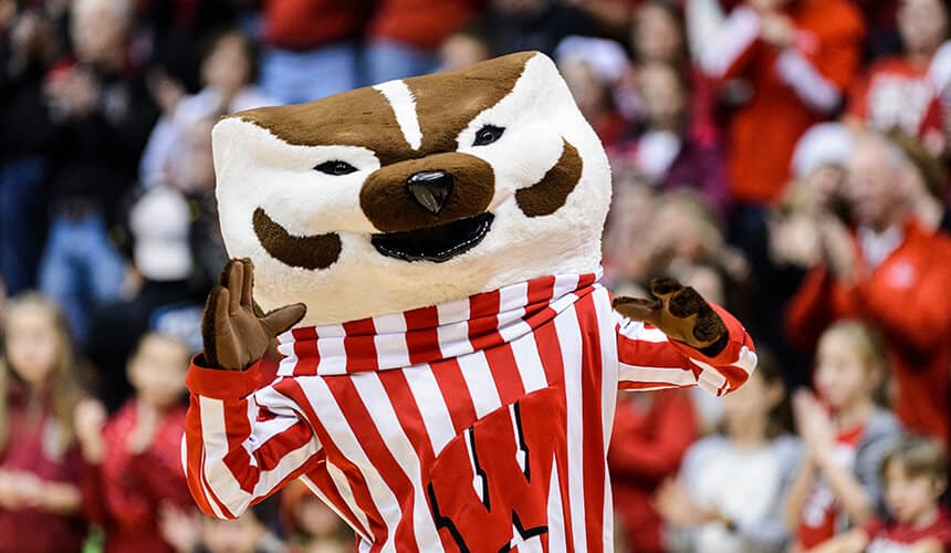 Bucky hyping up the crowd during a volleyball game.